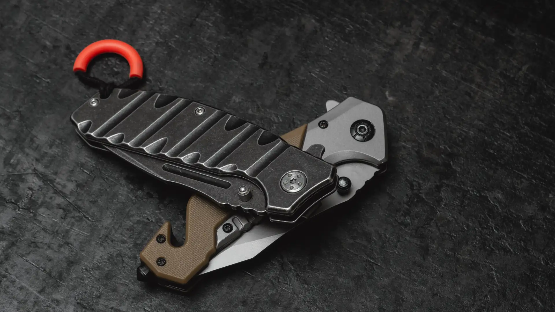 two-folded-tactical-military-knives-dark-concrete-background 1_1x